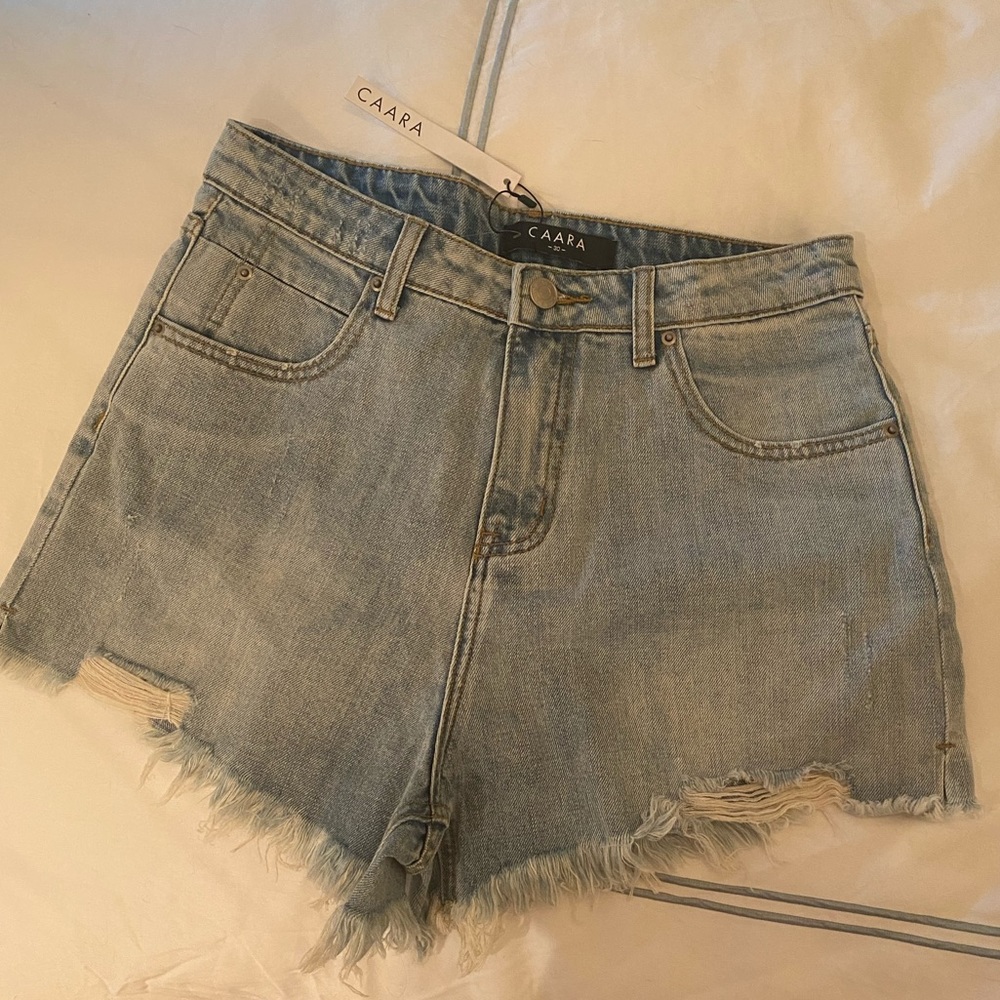 CAARA NWT Distressed Jean Shorts
